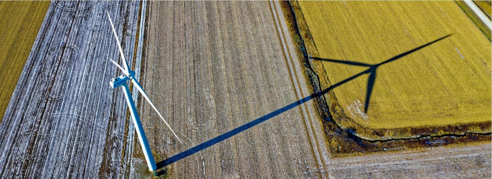 high-angle-photo-of-wind-turbine-on-field