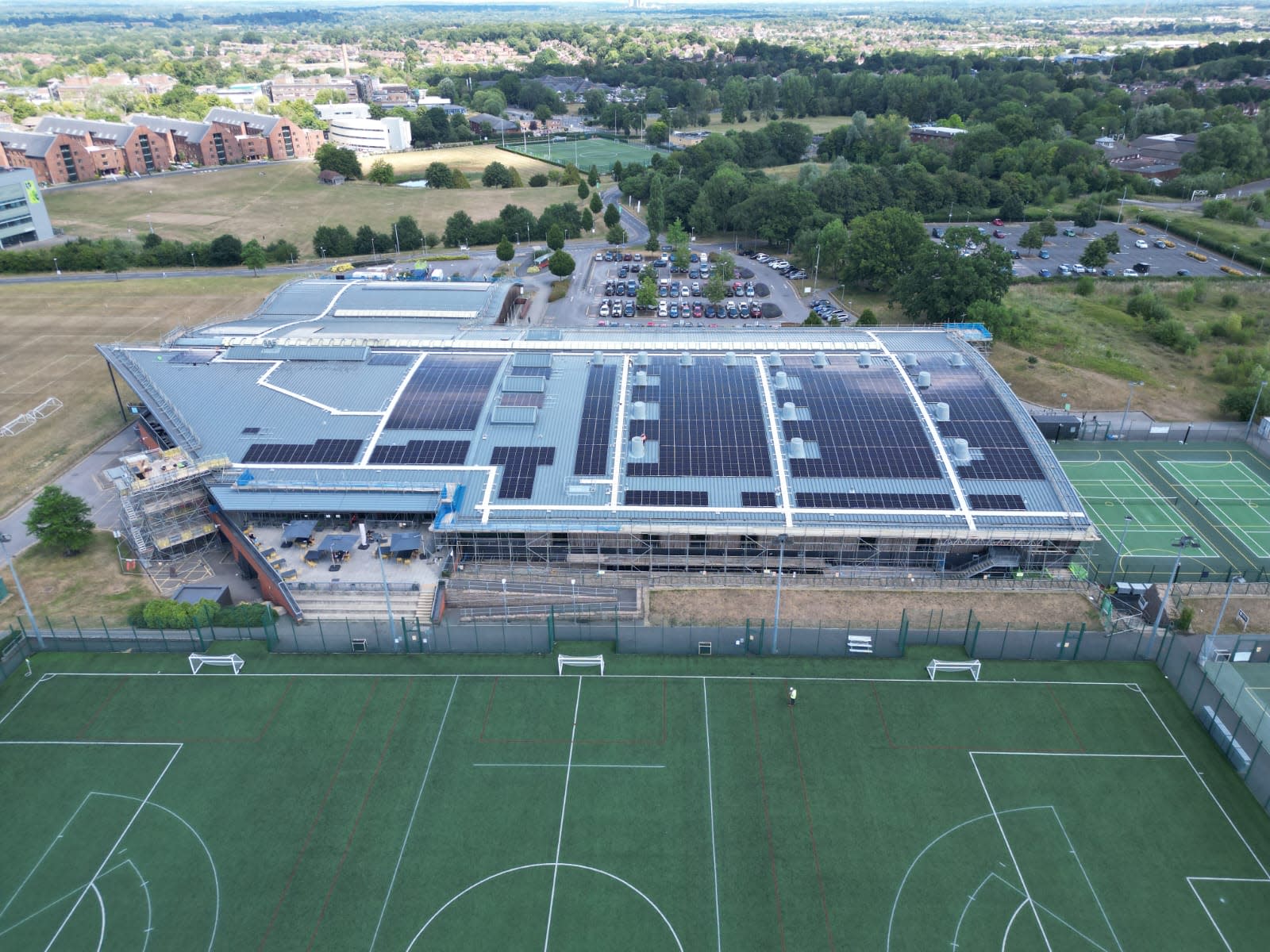Sports park from above, with main building roof showing solar panels