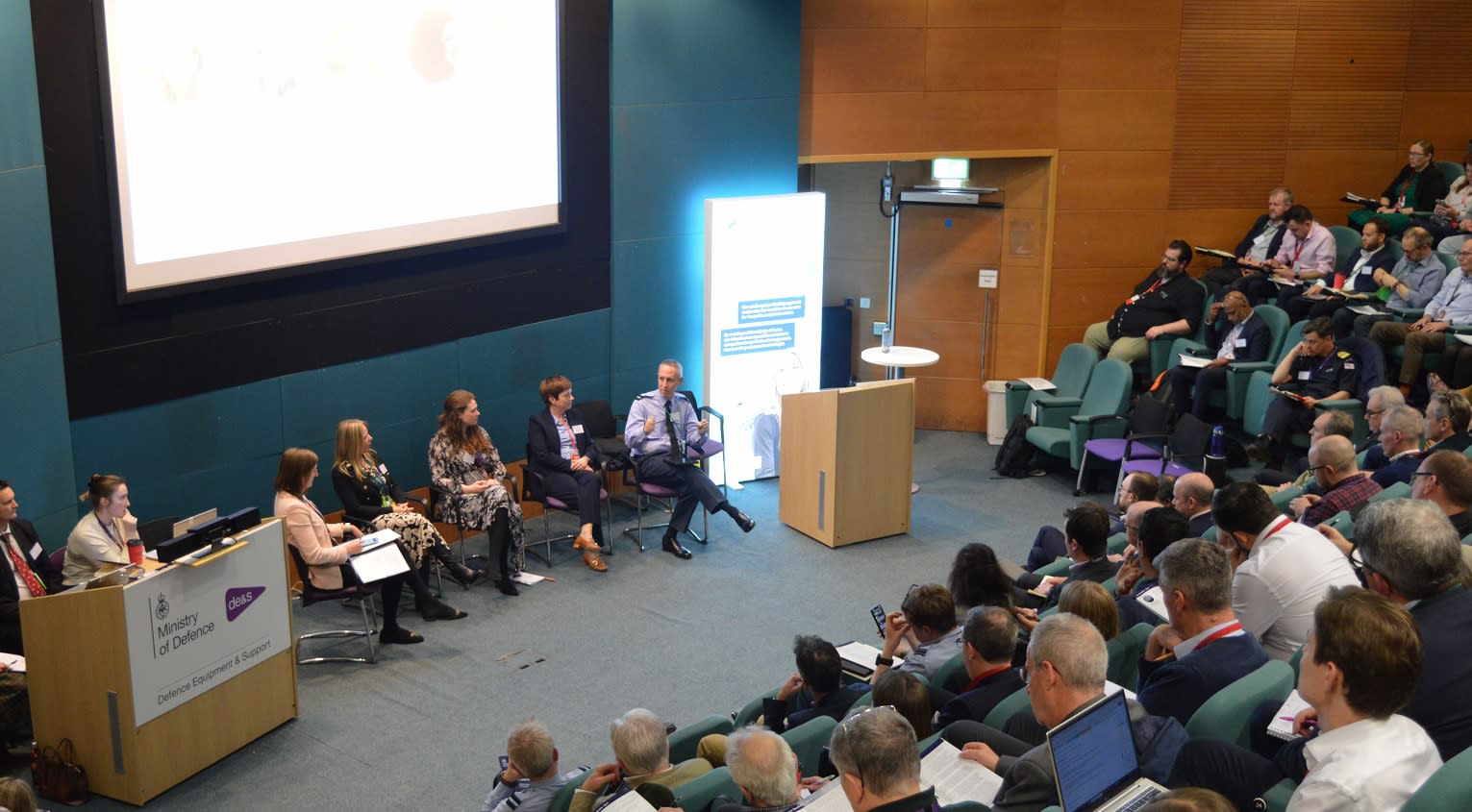 Image from the MoD event in February 2025 showing view of speaker panel and audience.