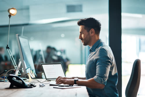 Man sitting at office desk