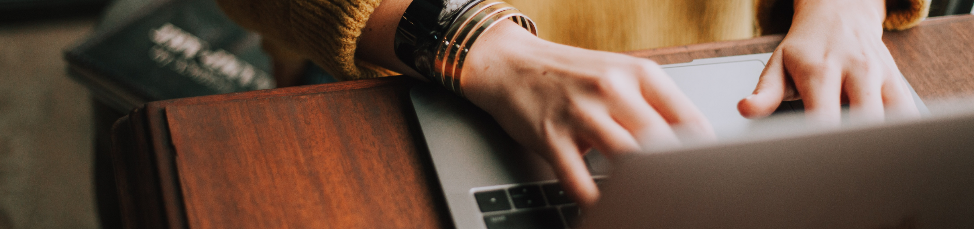 Hands typing on keyboard