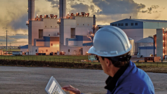 Man on tablet checking SSE Virtual Power Plant