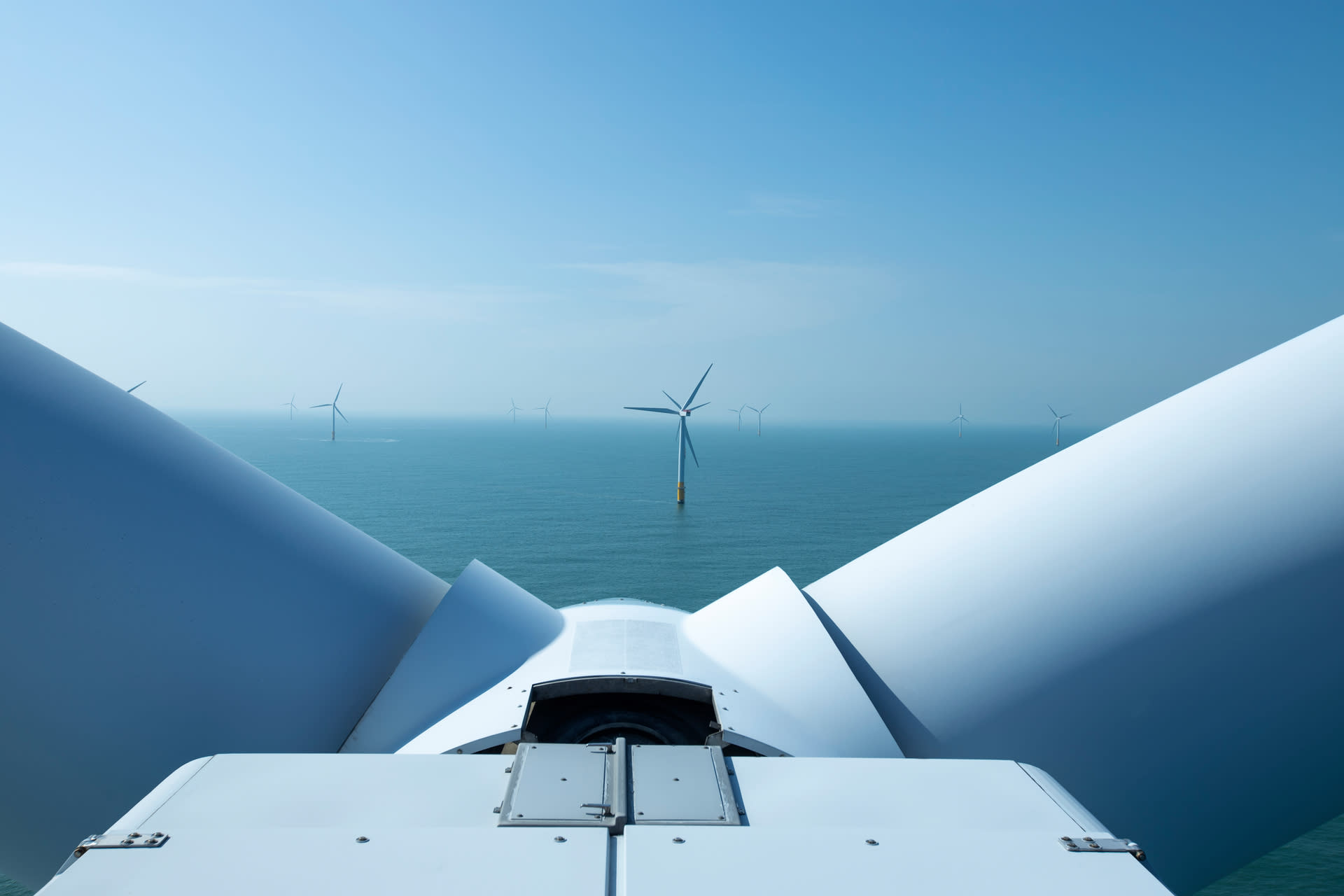 Top of a wind turbine, looking out to sea and another turbine in the distance