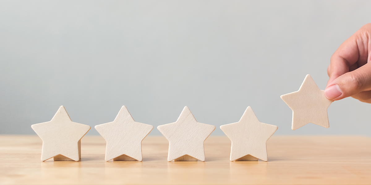 5 wooden stars on a table