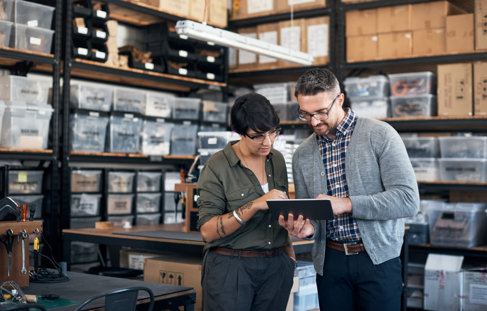 Workers in a factory on tablet