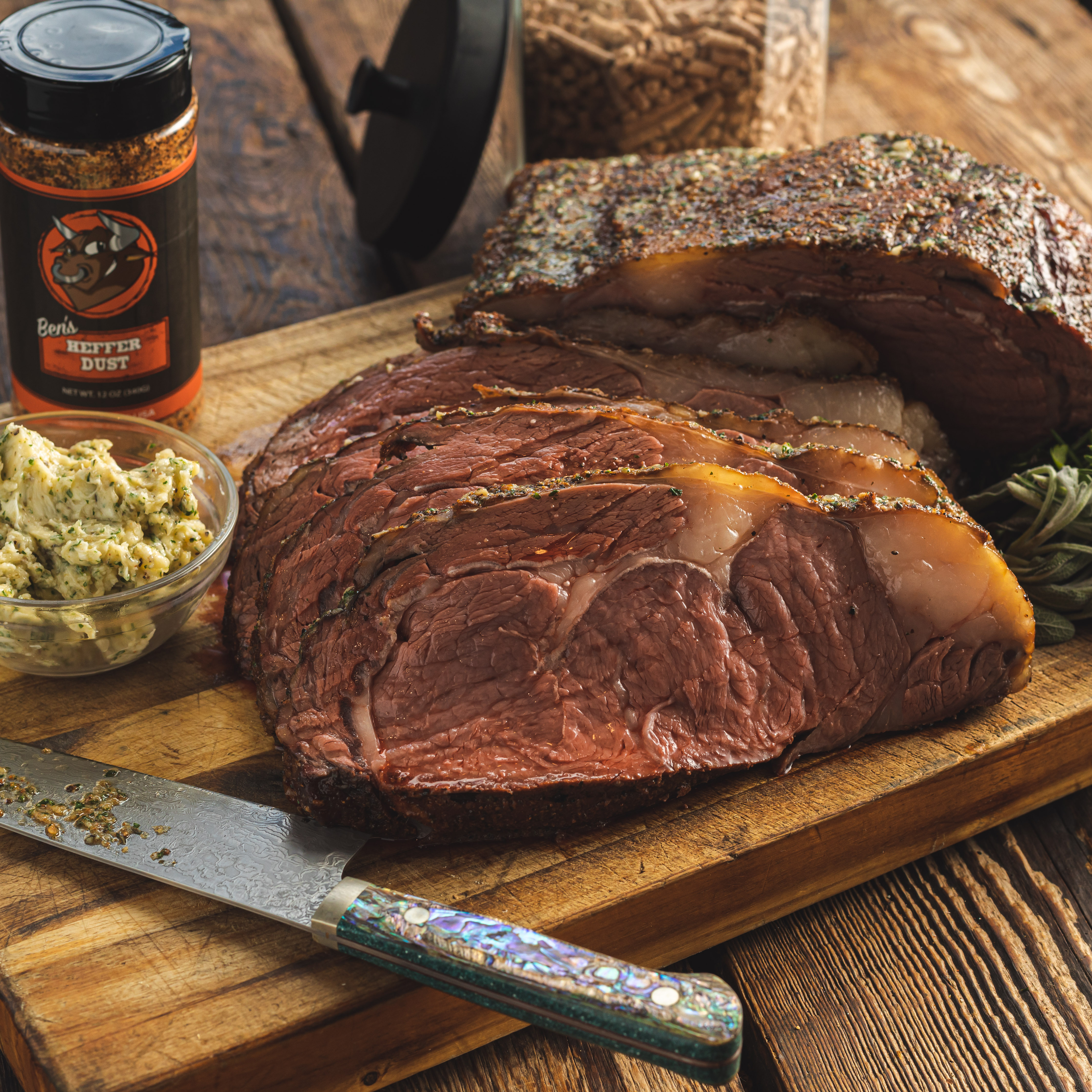 Sliced Roasted Prime Rib With Knife On Plank Stock Photo