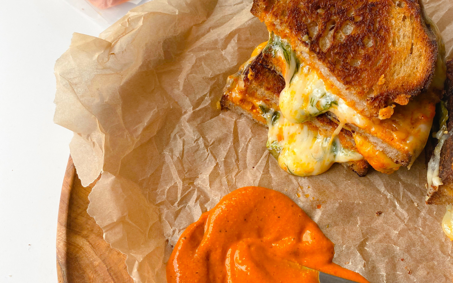 https://images.ctfassets.net/px4cqjx727yq/77iHrzaRUFY0pj7Ofyuk1F/bb370beabea114d9f535aa45eccd6b3a/Red_Pepper_Romesco_Grilled_Cheese.png?q=90&w=1680