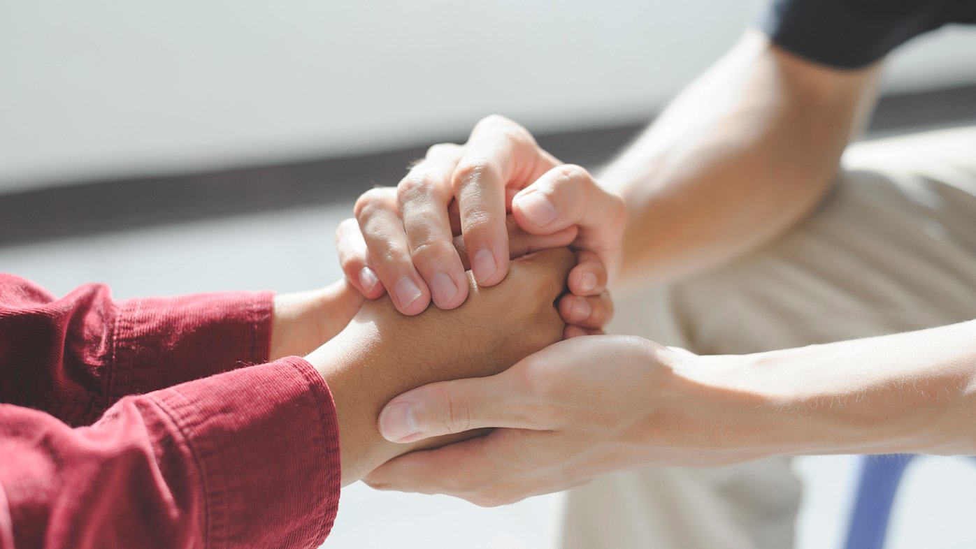 Hands Being Held in Support