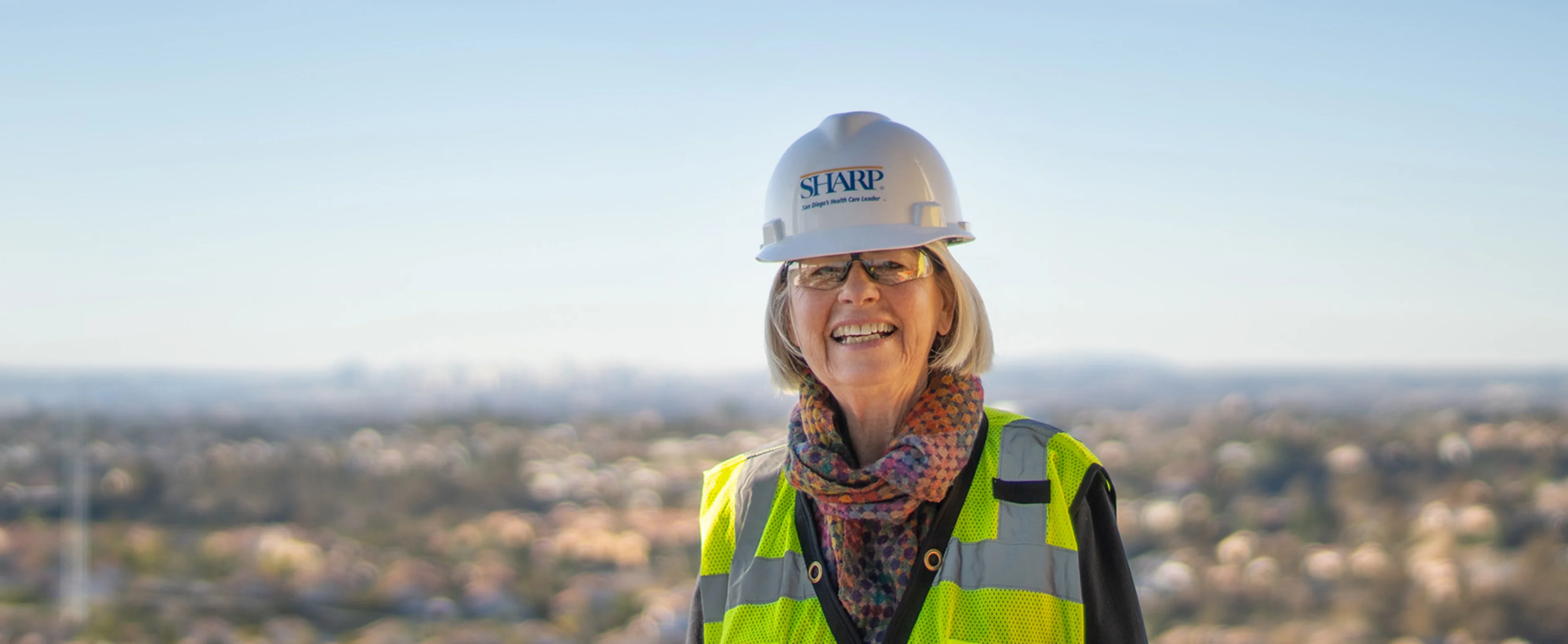 Woman smiling in Sharp hardhat