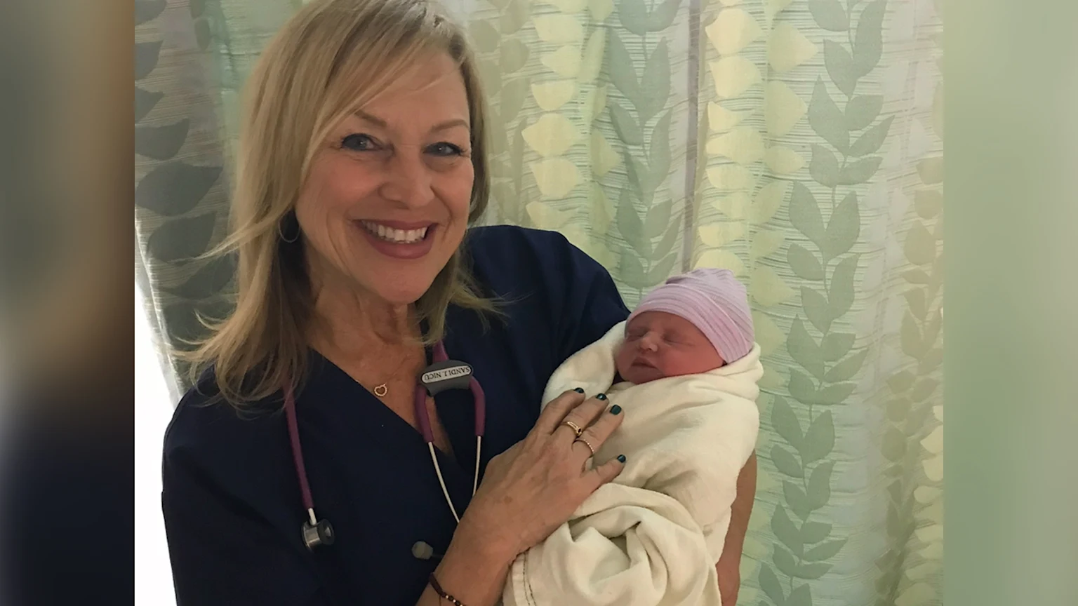 Sandi-Julian Stowe of San Diego Holding Her Granddaughter