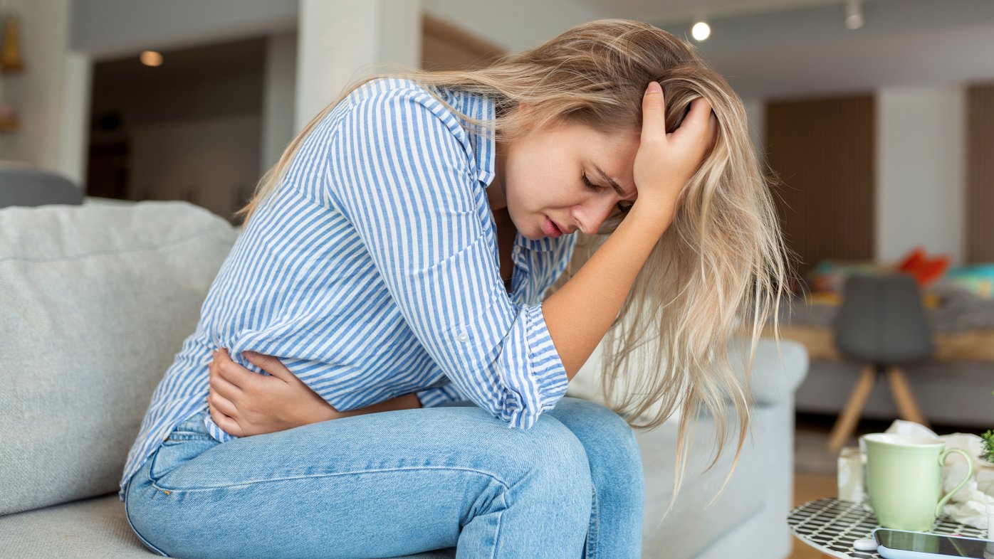 Woman experiencing stomach pain