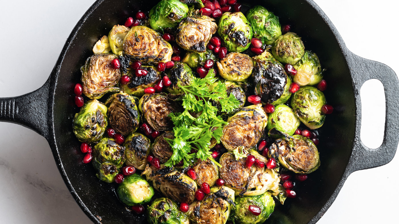 Brussels sprouts with pomegranates in cast iron skillet