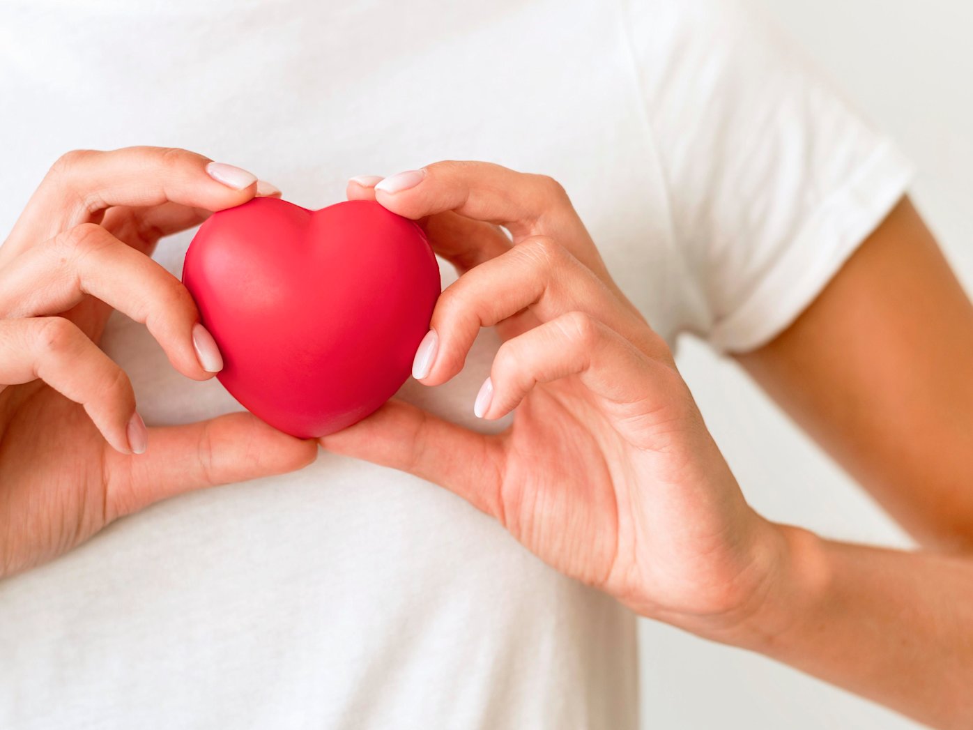 Hands holding red heart shape