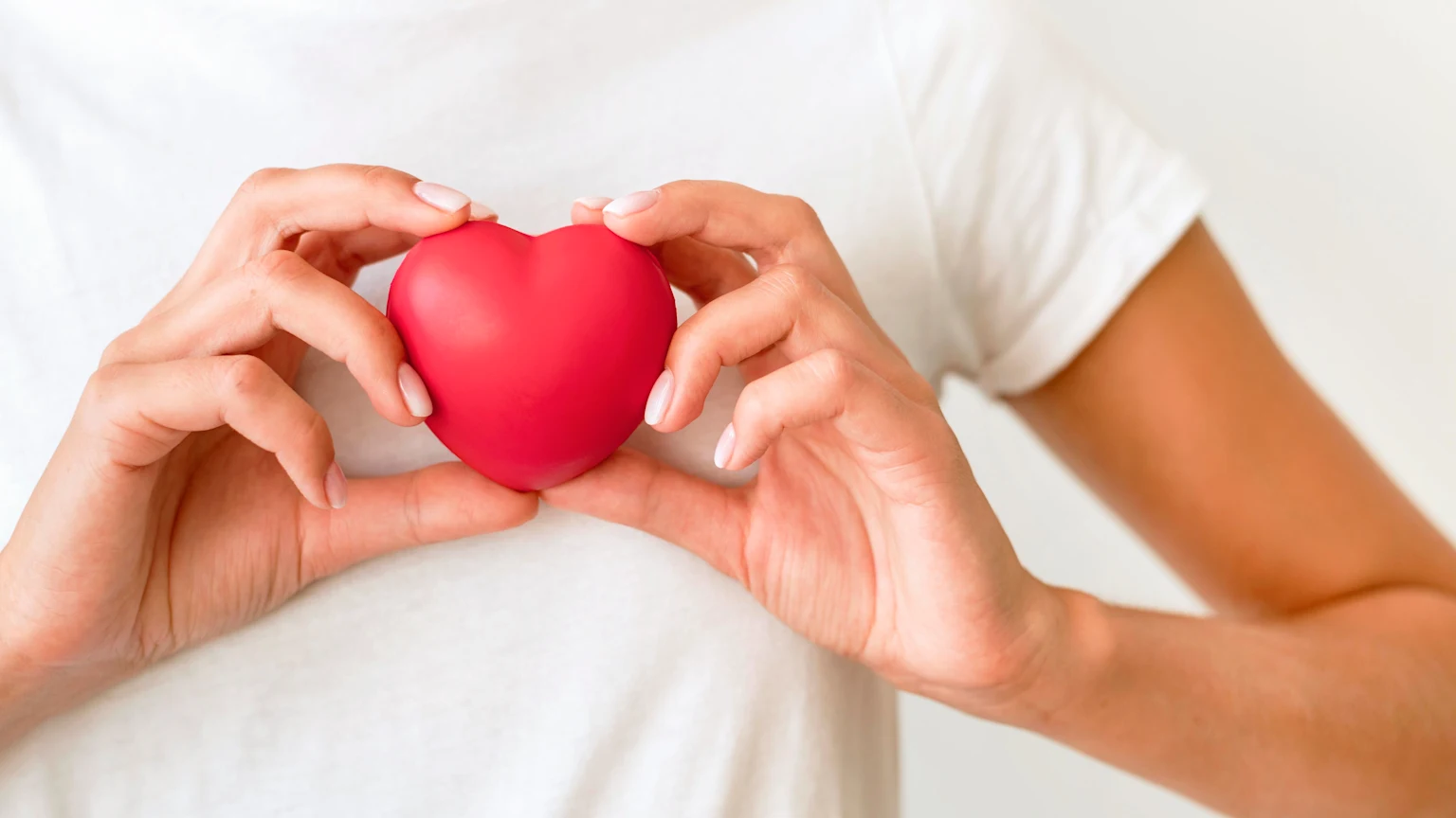 Hands and red heart