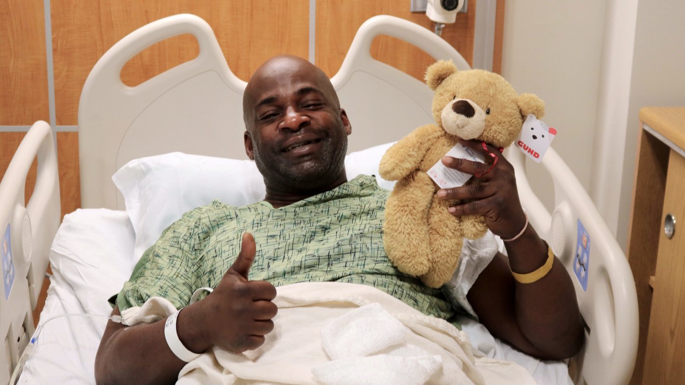 Leroy Callahan posing with his holiday bear at Sharp Grossmont Hospital