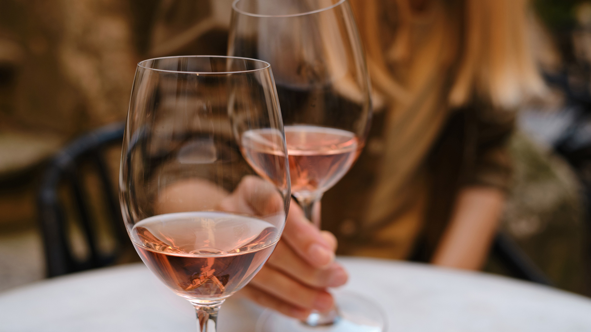 Two friends drinking rose