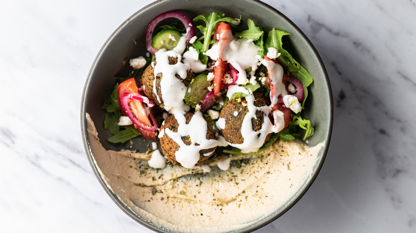Salad with hummus and falafel