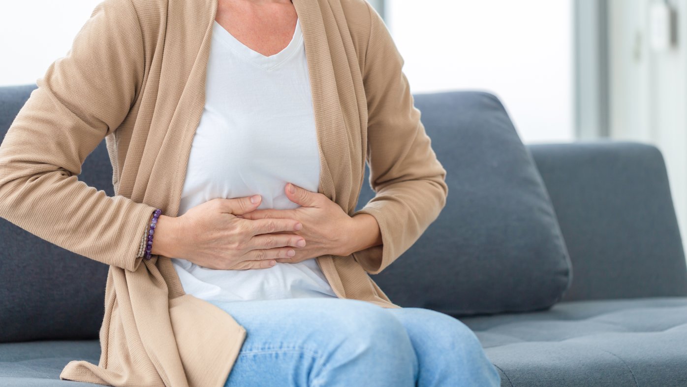 Person experiencing stomach pain
