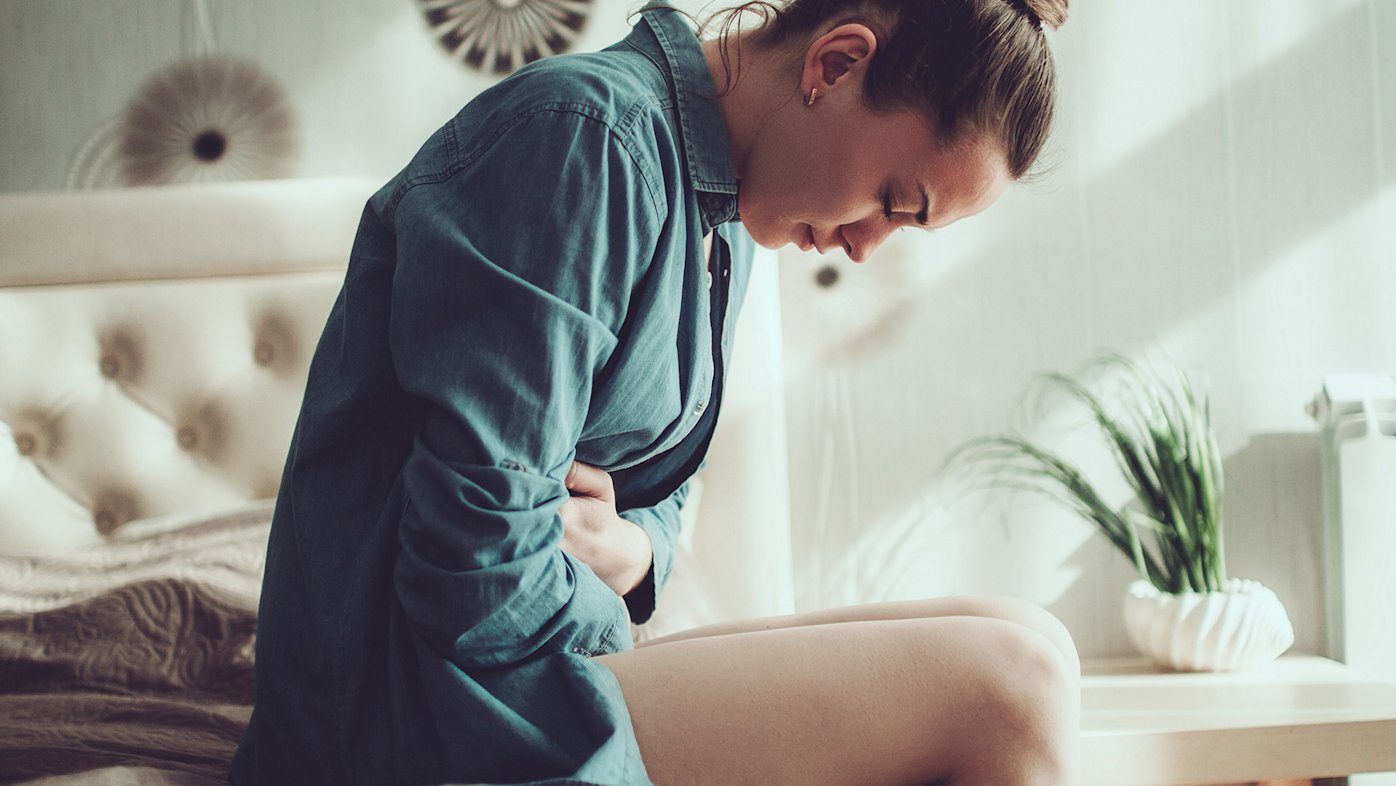 Woman Experiencing Abdominal Pain