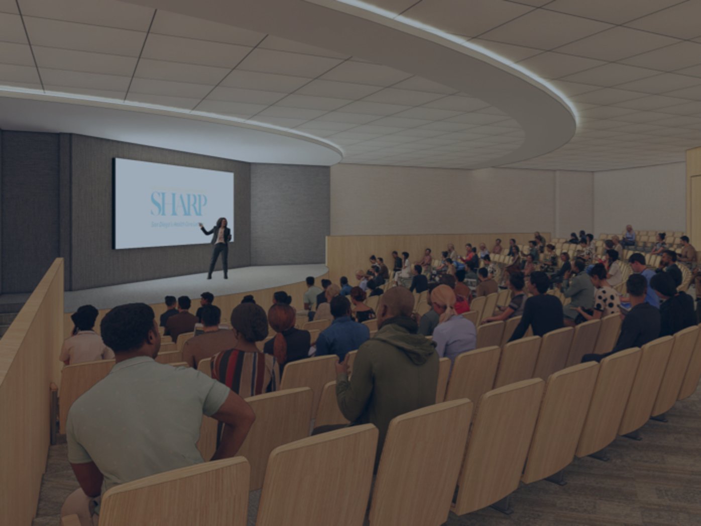 Artist rendering of auditorium with audience seated and presenter on stage