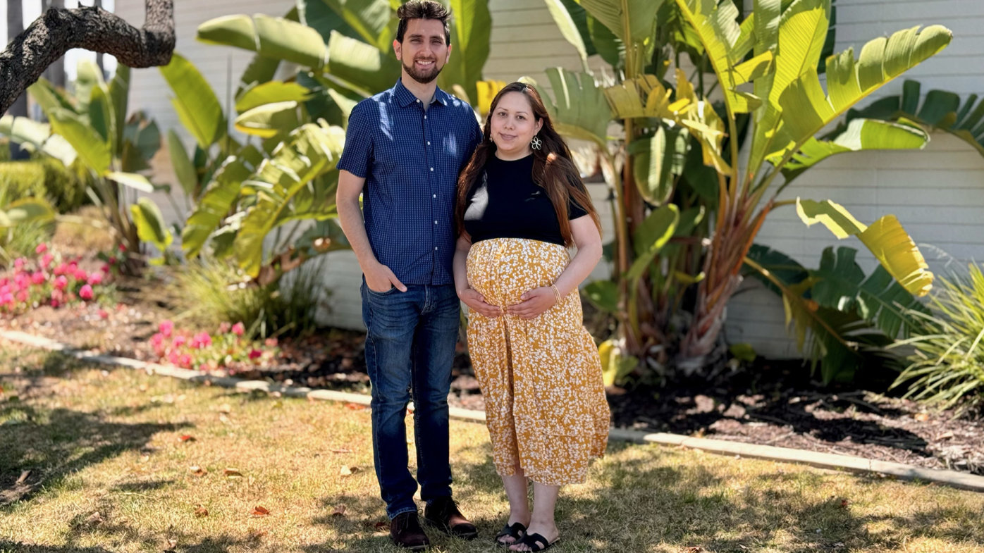 Damaris Lozano of San Diego holds her baby bump with husband Andrew Al-Shamas