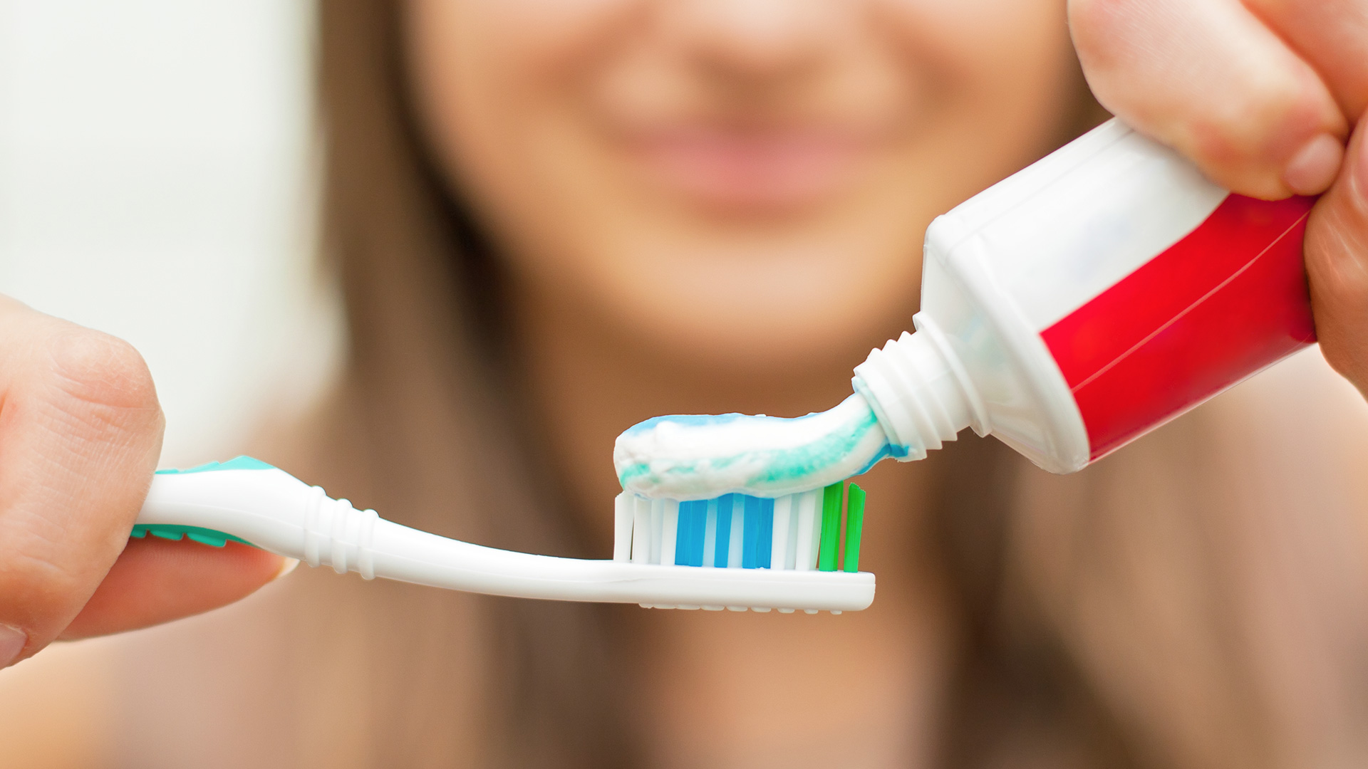 Toothpaste being used on tooth brush