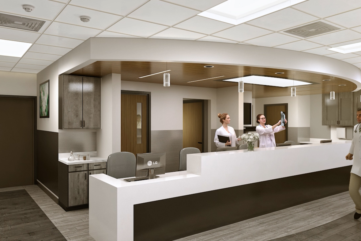 Artist rendering of nurses station with white desks and trim and dark brown wooden features