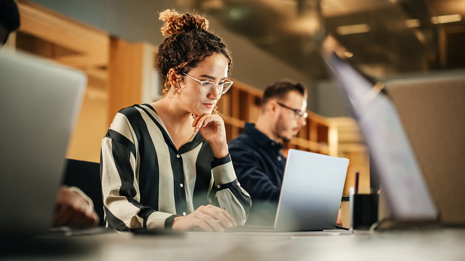 Woman in a cafe looking at a laptop