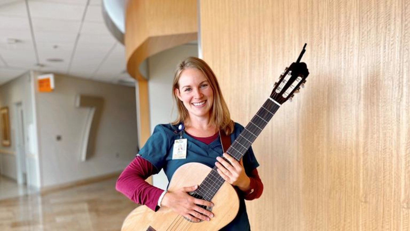 Amy Andrews, a music therapist with Sharp HealthCare's Arts for Healing program, with her guitar.