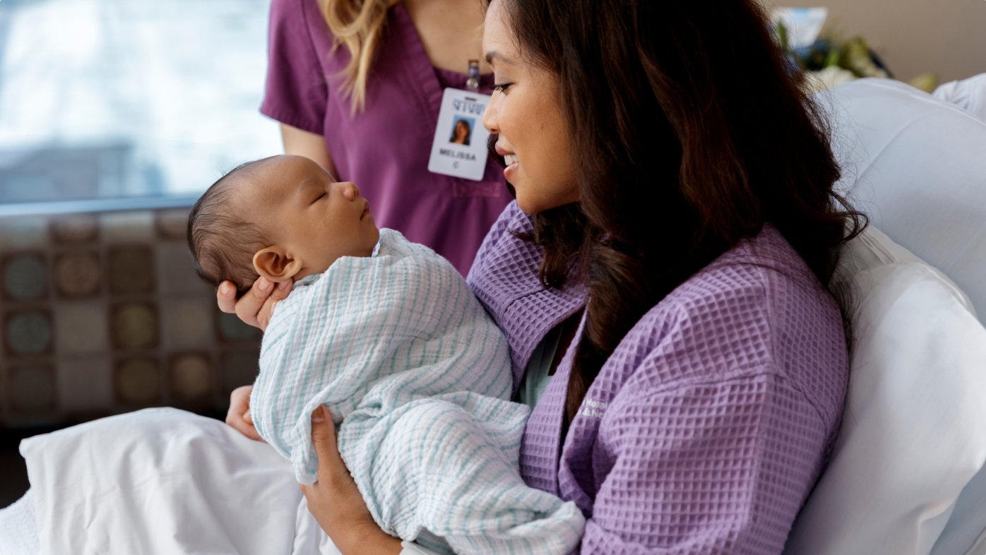 A mother holding new baby