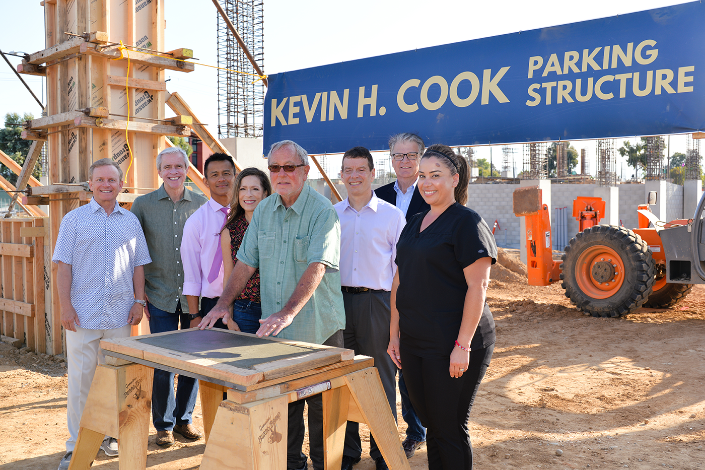 Kevin H Cook with Sharp leadership and care staff