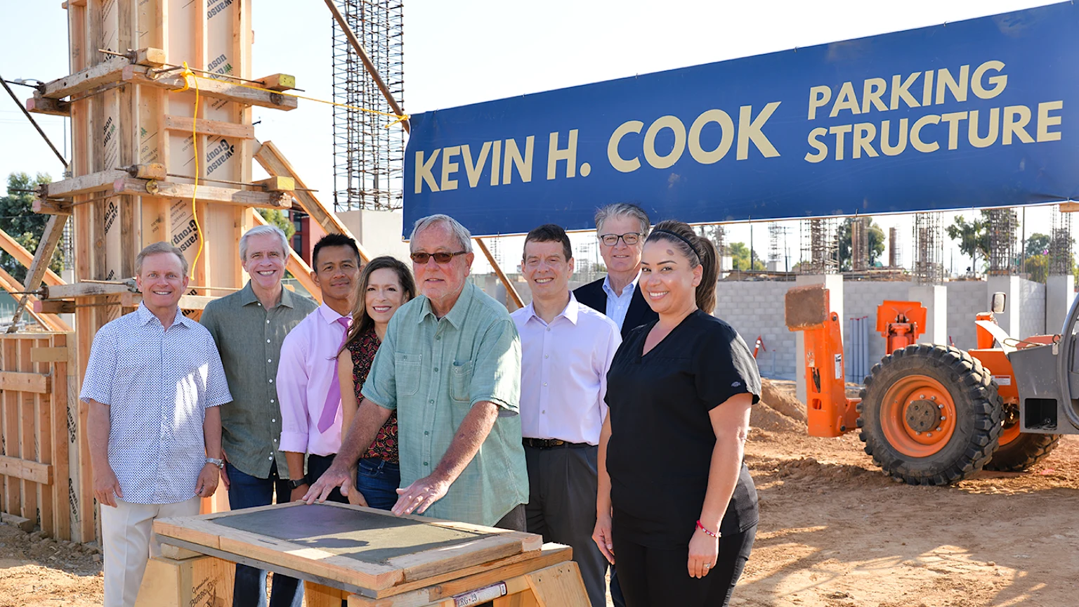 Kevin H Cook with Sharp leadership and care staff