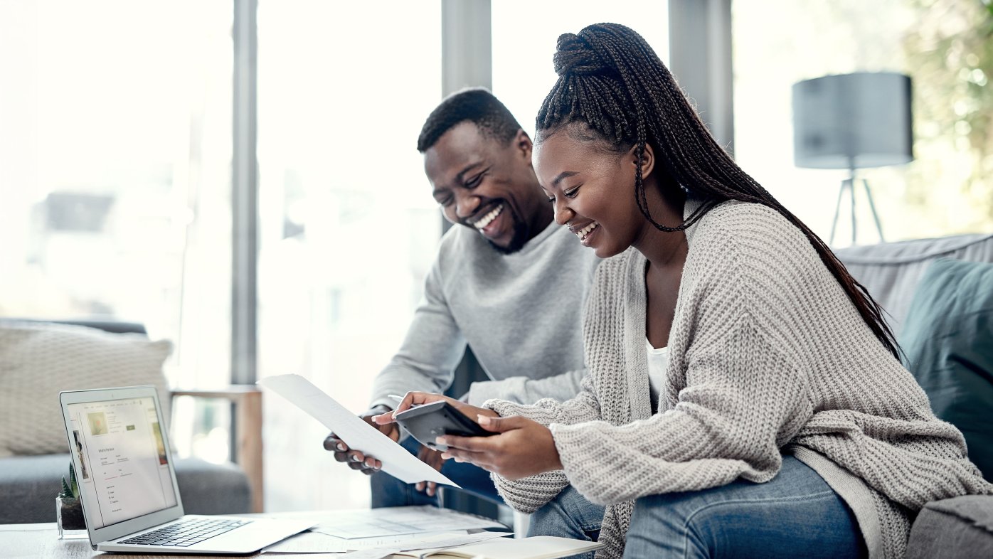 Young couple reviewing health insurance options.