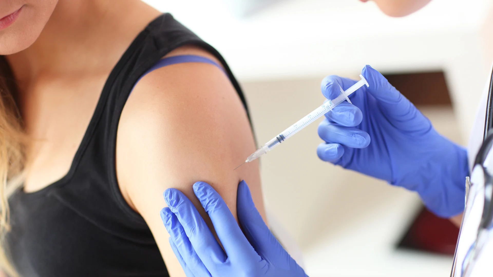 Patient receiving a vaccine in their arm