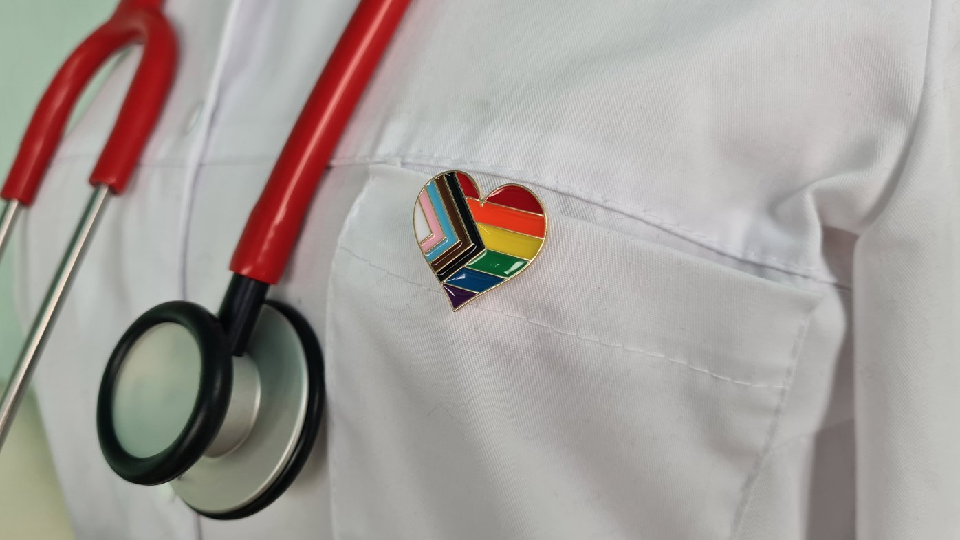 Doctor wearing stethoscope and rainbow pin