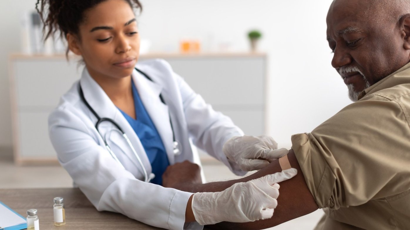 Nurse vaccinating patient