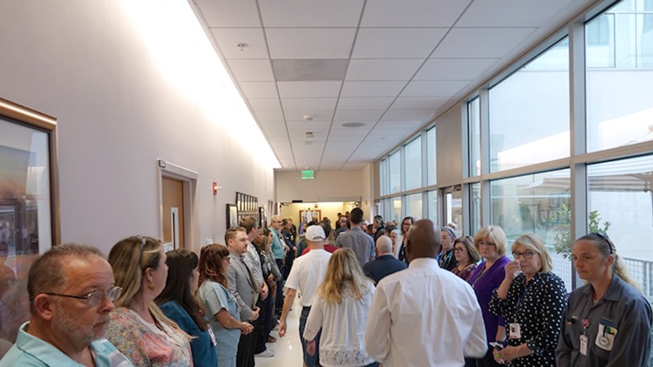 The honor walk: family and friends line the halls