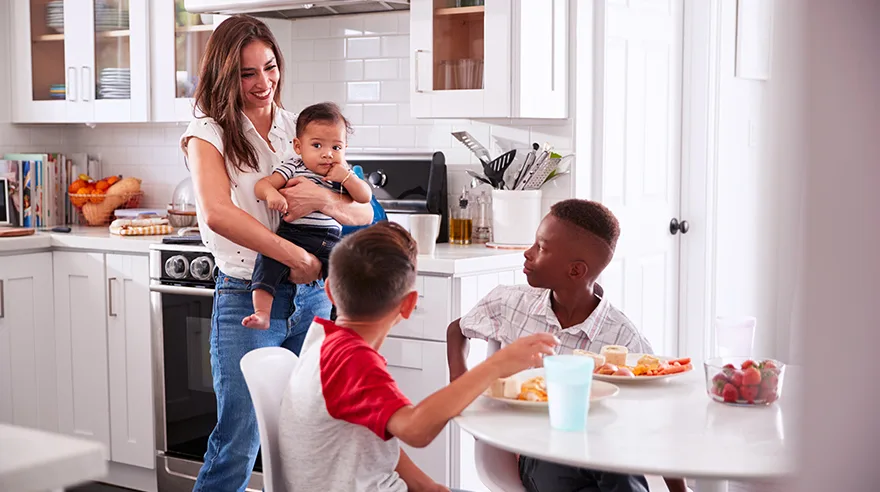 Mother with baby and two older older kids