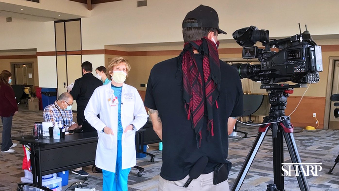 Sharp Coronado Hospital CEO Susan Stone, PhD, talks with the media at the hospital's community vaccination clinic.