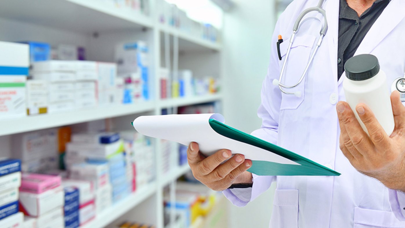 Pharmacist filling prescription in pharmacy drugstore