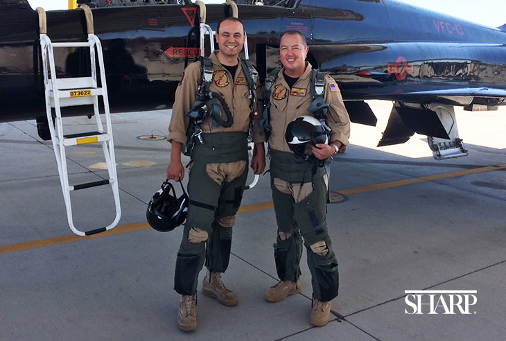 Dr. Joseph Allen (right), a family medicine doctor affiliated with Sharp Community Medical Group, works with tactical pilots in San Diego. He is pictured with CDR David "Martian" Anderson.