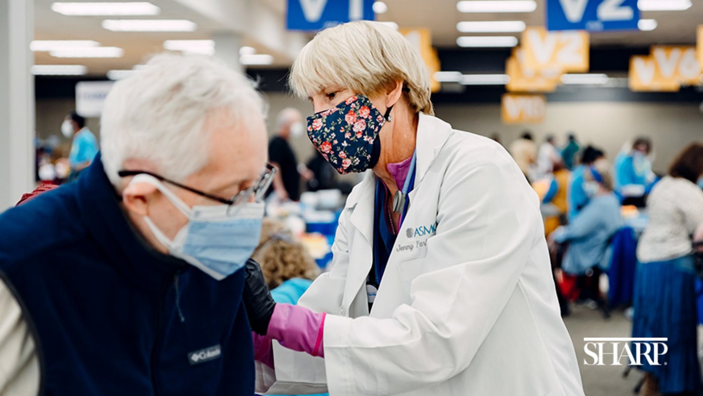 Dr. Jenny Parker spends her mornings in the operating room and afternoons at the Sharp South Bay Super Station as a volunteer vaccinator.