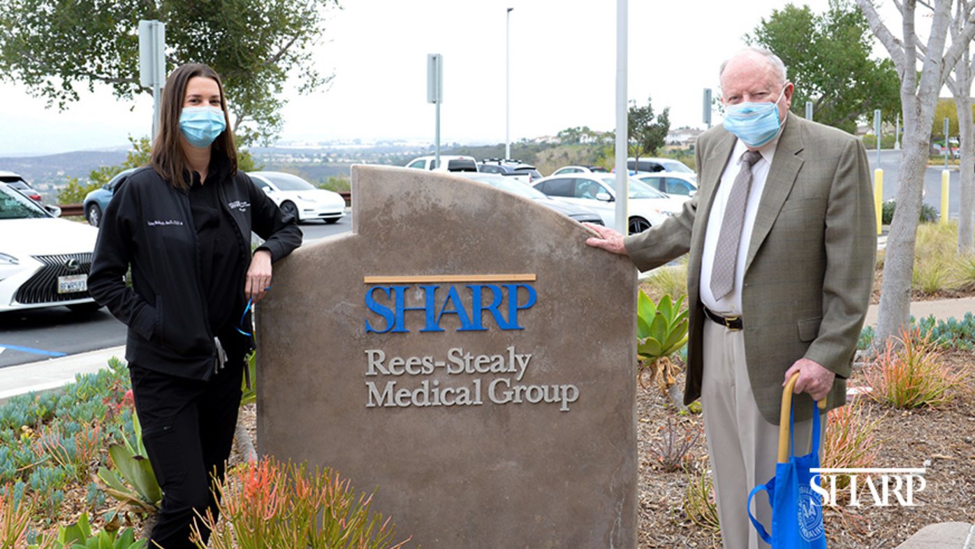 Dr. Kristy Baldwin (left), a clinical audiologist with Sharp Rees-Stealy Medical Group, with patient and donor John Redfield.