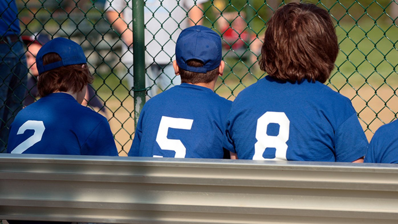 Baseball players sitting on the bench