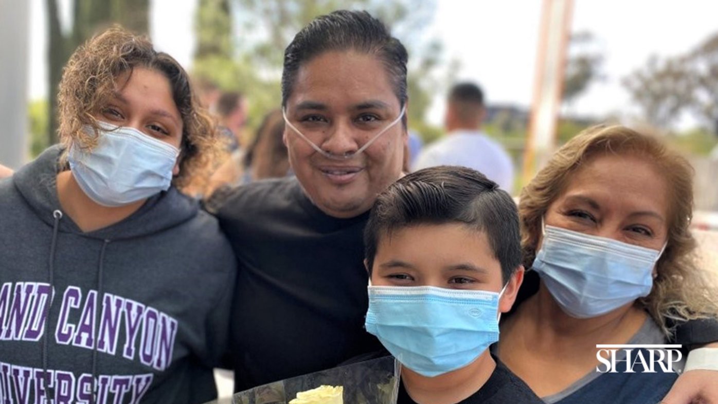 Danny Plata reunites with his mother (right), daughter (left) and son outside of Sharp Memorial Hospital following an 11-week hospital stay for severe COVID-19.  