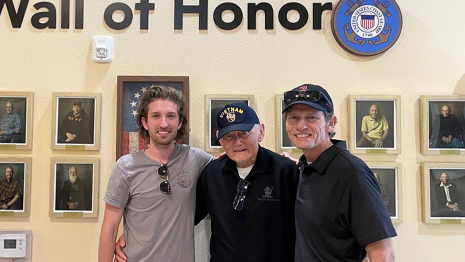 Veteran Doug Beach at the Veterans Honor Wall at Westmont of La Mesa senior living community 