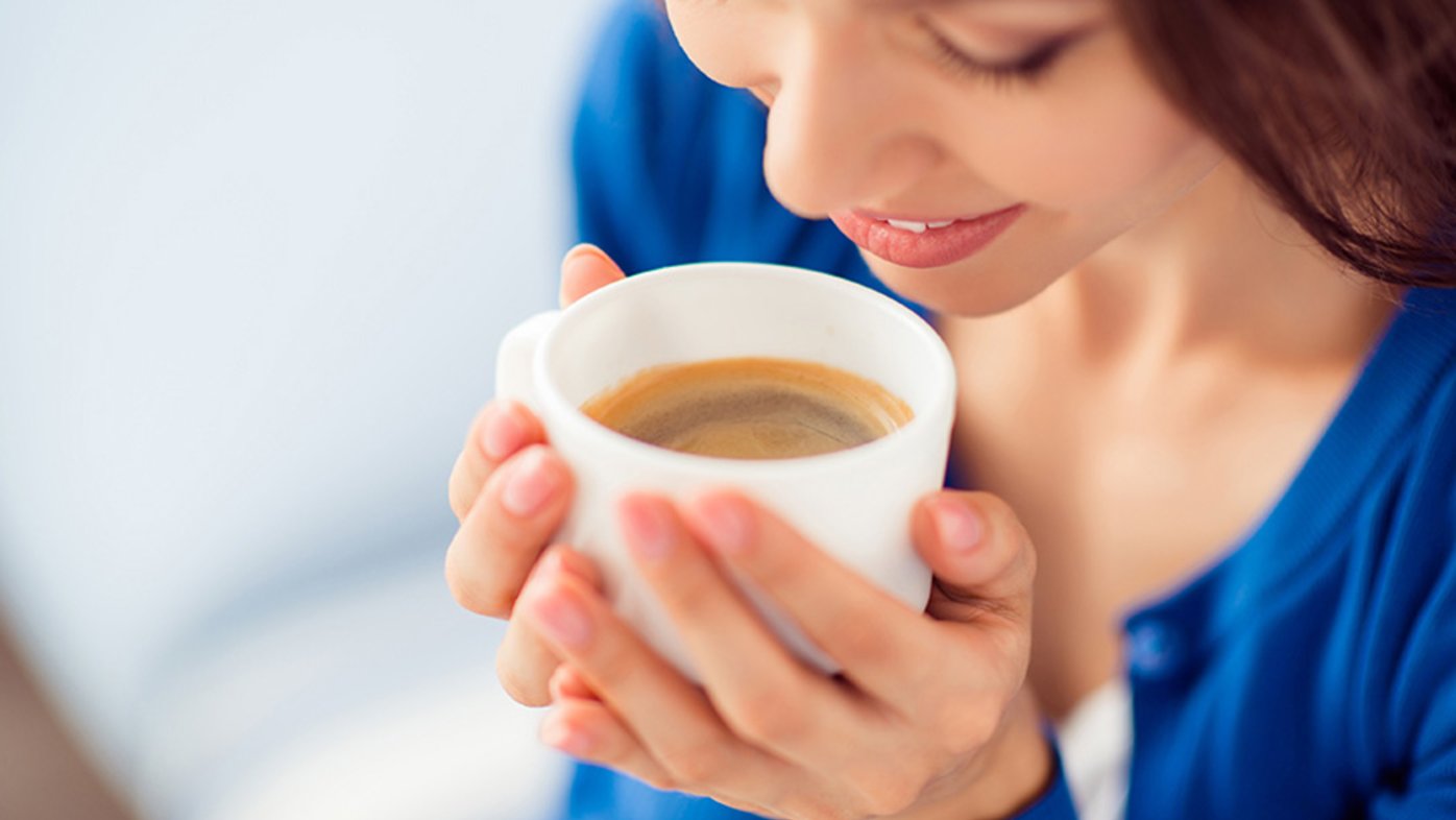 Woman drinking tea or coffee