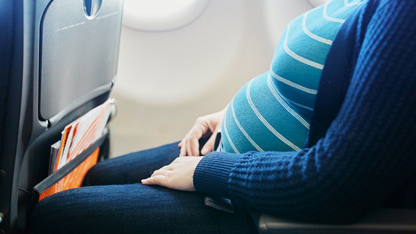 Pregnant woman on airplane