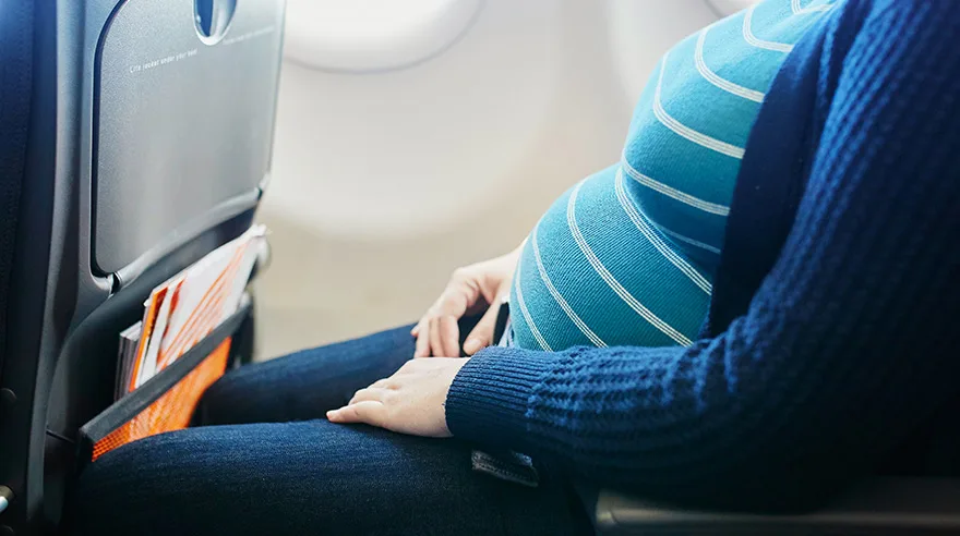 Pregnant woman on airplane