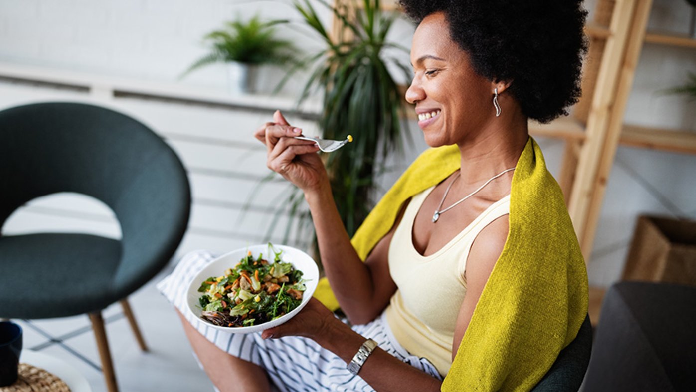 Woman eating salad